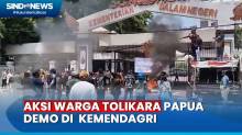Puluhan Warga Tolikara Papua Demo dan Bakar Ban di Medan Merdeka Utara
