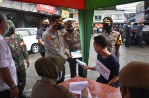 Polres Bogor Jaring 55 Pelanggar PPKM Stasioner di Babakanmadang