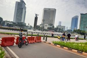 Covid-19 di Jakarta Mulai Mereda, Warga Berolahraga dan Pesepeda Ramai di Bundaran HI