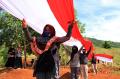 Peringati Sumpah Pemuda, Karang Taruna Puriala Bentangkan Bendera Merah Putih Sepanjang 200 Meter