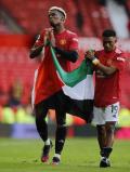 Potret Paul Pogba dan Amad Diallo Kibarkan Bendera Palestina di Old Trafford