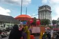 Antusiasme Warga Menonton Karnaval Budaya HUT Palembang Meski Turun Hujan