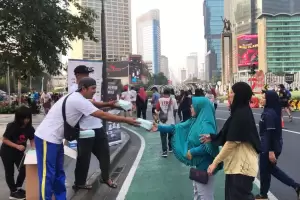 2 Juta Masker Dibagikan MNC Peduli dan Ormas Oi BPW DKI di CFD Jakarta